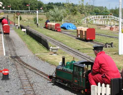 Photo of passenger trains on the ground level track